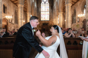 Bride and groom first kiss moment